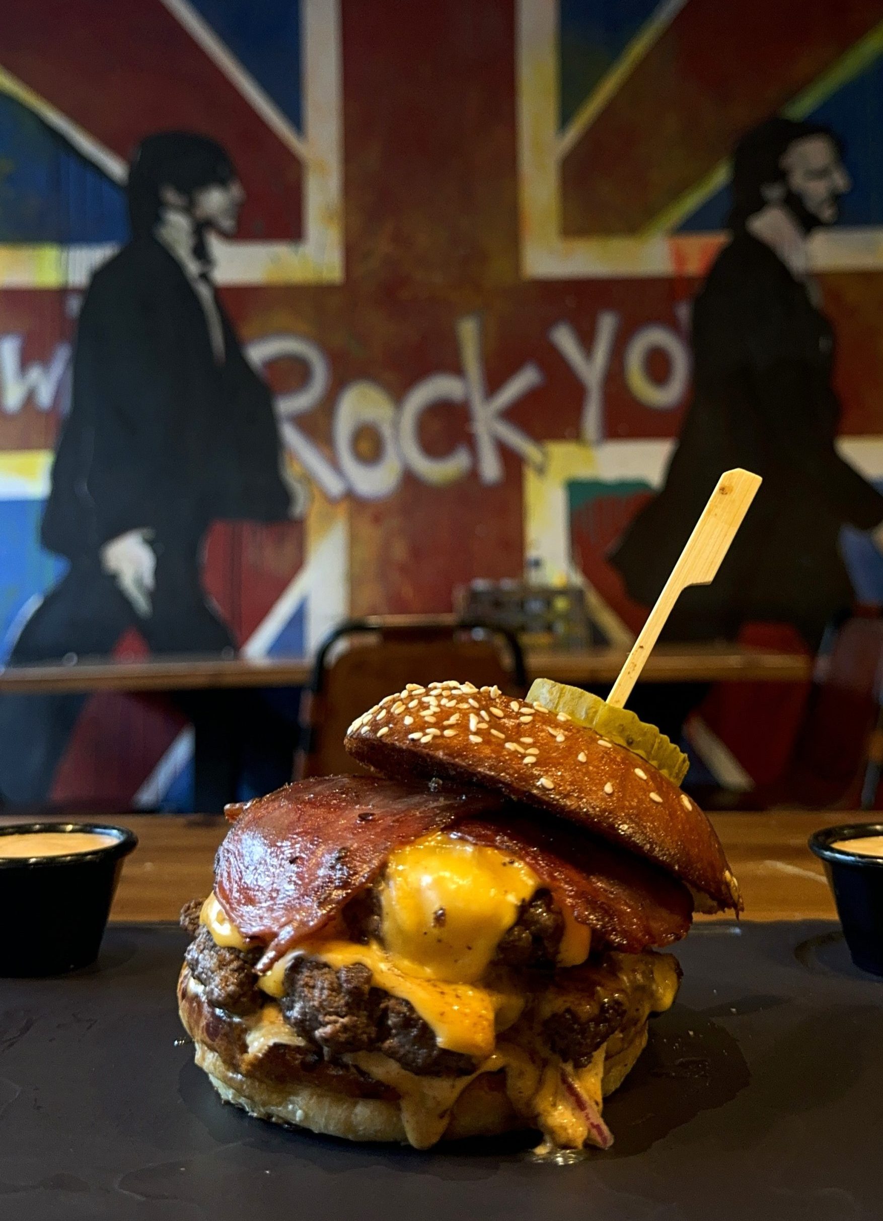 lvis Burger with double Angus beef patties, American cheese, turkey bacon, and truffle honey glaze at Band of Burgers restaurant in London